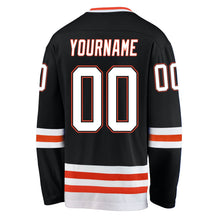 Laden Sie das Bild in den Galerie-Viewer, Uksn Individuelles Schwarz Weiß-Orange Eishockey-Trikot